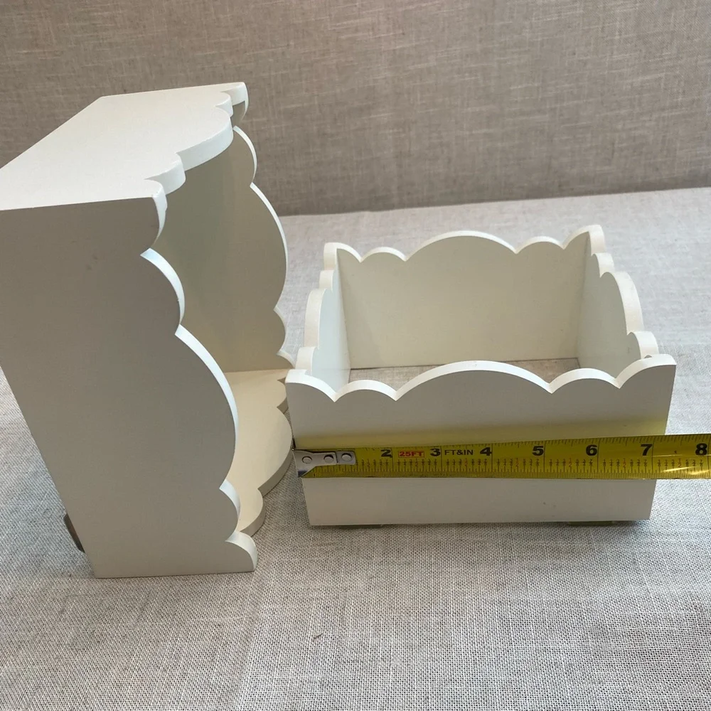 Two wall hanging white shadow boxes.